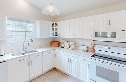 Gulfview Heights House | Modern dog-friendly home near the Gulf with yard, grill, screened porch & bikes