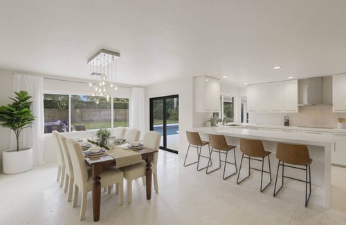 Moorings House | Modern Oasis: Private Beach Access. Minutes from Downtown & Optional Golf Cart