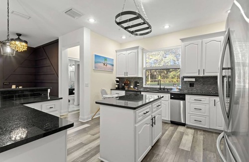 Port Richey House | Modern Spacious Getaway: Heated Pool, Movie Room, Huge Yard & Event-Friendly in New Port Richey, Florida