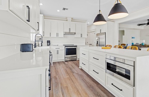 Creole House | Modern waterfront home with boat lift, dock, game tables, kayak, & AC