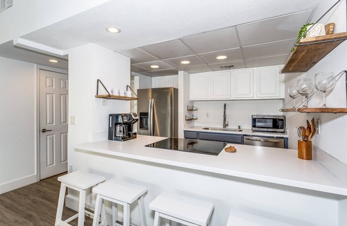 Villa Sabine Condo | New! Centrally located 1 bed 1.5 bath with water views!