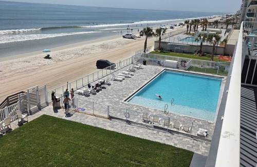 Daytona Beach Condo | Ocean front Oasis. Pool is OPEN. Cozy Ocean front views of Daytona Beach.