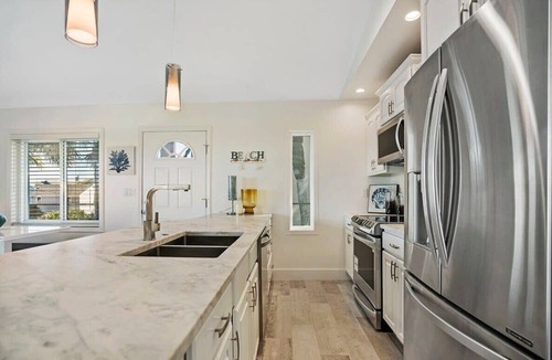 Butler Beach Apartment | Ocean Views, Beach Bikes, Sunny Deck, Steps 2 Sand