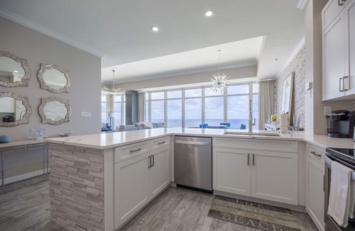 Thomas Drive Condo | Penthouse corner, floor to ceiling windows, high ceilings 2 primary a guestroom