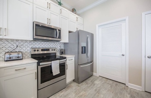 Thomas Drive Condo | Penthouse corner, floor to ceiling windows, high ceilings 2 primary a guestroom