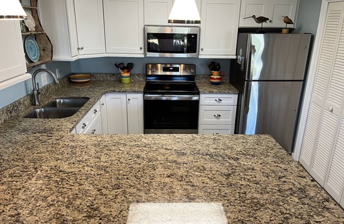 Gulf Place Condo | Perfect Beach Getaway! 2 BR 2 BA Ground floor End Unit! Steps From The Beach!