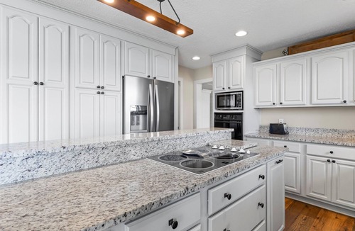 Dadeville House | Perfect for large families & group getaways on Lake Martin. Flat yard + private beach (rare), double-slip dock, and sunset views. Sleeps 16+ with space to spread out, plus firepit + game room for nights in.