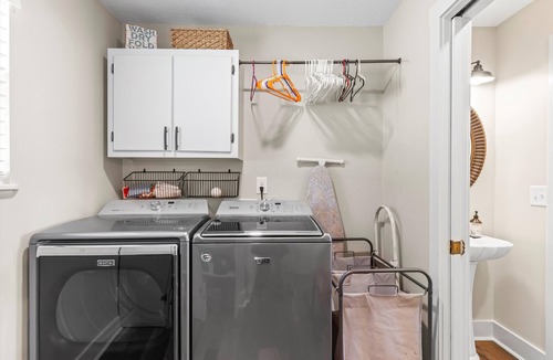 Dadeville House | Perfect for large families & group getaways on Lake Martin. Flat yard + private beach (rare), double-slip dock, and sunset views. Sleeps 16+ with space to spread out, plus firepit + game room for nights in.