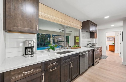 Moorings House | Pesaro Vacation Rental: Stylish 3-BR Retreat Near Via Miramar Beach. Renovated Home with Private Pool, Lush Gardens and Modern Comforts. Perfect for Families, Close to Beaches and Downtown Naples!