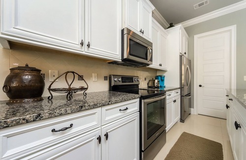 Villa Lago House | Pet Friendly ~ Water View ~ 2 Golf Carts ~ Community Pool