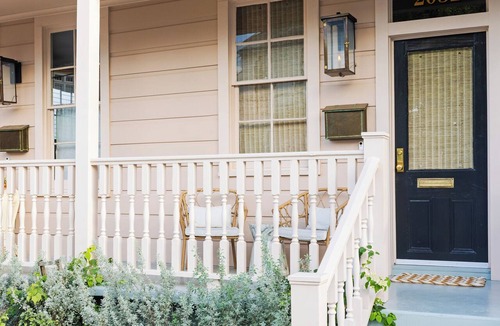 Lower Garden District Apartment | Porch Life and Local Nola Magic in a Newly Renovated Space!