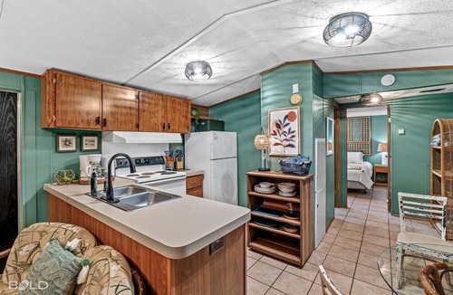 Uncertain Cabin | Relax and unwind with kayak access, covered outdoor living, a charcoal grill, and a short stroll to a charming café.