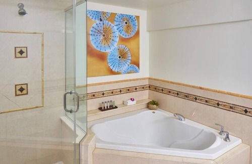 Pelican Bay Resort | Relax in Three Relaxing Rooms with Balcony, Beach & Outdoor Pool Access