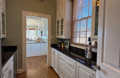Magnolia House | Relax sitting on wrap around porch in this Historic Mansion