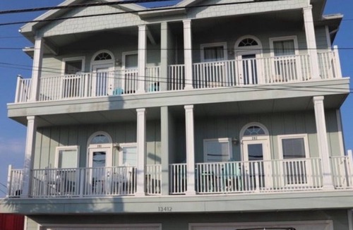Bahama Beach Condo | Remodeled 3 BR/2BA condo steps to the beach! Sunset views and private garage.