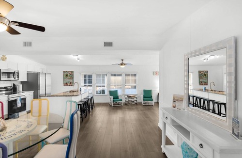 Bayside Park House | Renovated canal-front pet-friendly home with a fireplace and boat dock, steps away from the marina!
