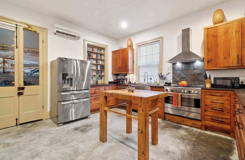 Seventh Ward House | Rustic Industrial Home w heated Pool/Hot Tub, Steps to FQ
