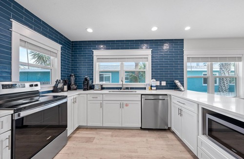 Kiska Beach House | Scenic Stays coastal 3-bedroom home just steps from the beach with a pool!