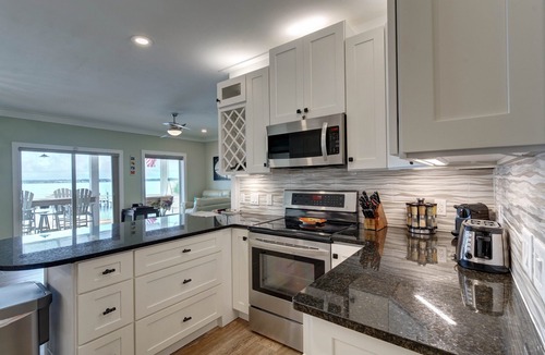 Navarre Beach House | “Semi-Retired”-Elevator-Pier-200+ 5 Star Reviews-Toys-Golf Cart Rental -EV Charg