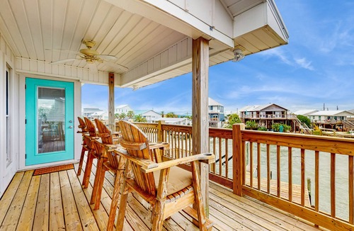 Royal Lagoons House | Serene sound-front home with a covered patio, dock, and swing bed