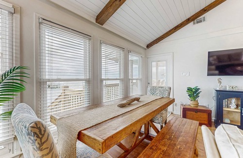 Royal Lagoons House | Serene sound-front home with a covered patio, dock, and swing bed