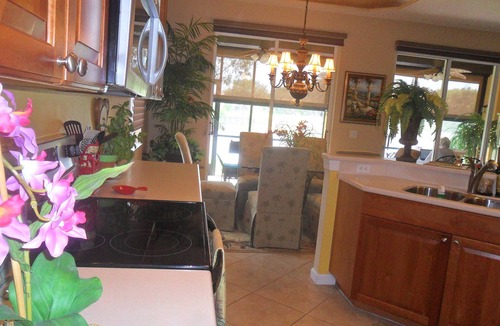 Bonita Springs Condo | SERENE VIEWS FROM 24' Lanai view lake/golf , coach home 1st floor.