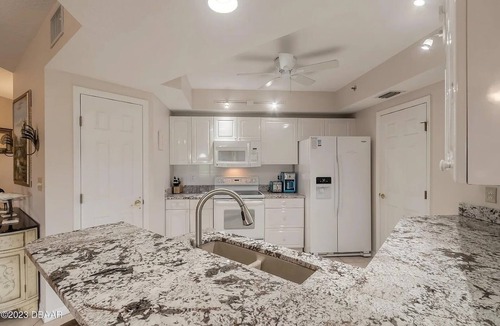 New Smyrna Beach Condo | Serenity Sands: Escape to the seaside resort of Oceanwalk in New Smyrna Beach