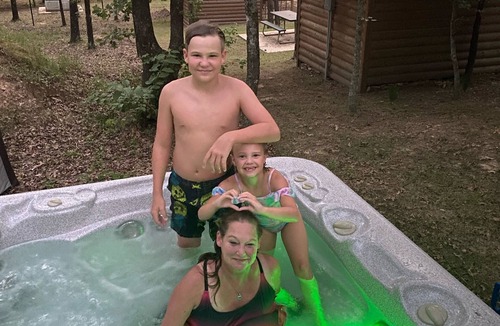 Hugo House | Small one room cabins with no bathrooms hot tub and covered picnic tables.