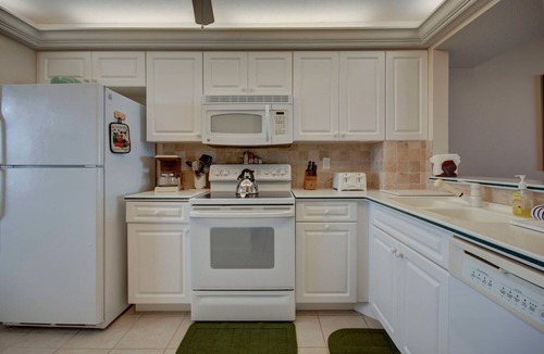 Marco Island Condo | South Seas Tower 4 #701 Looking at Sunset. Decorated with light pastel décor.