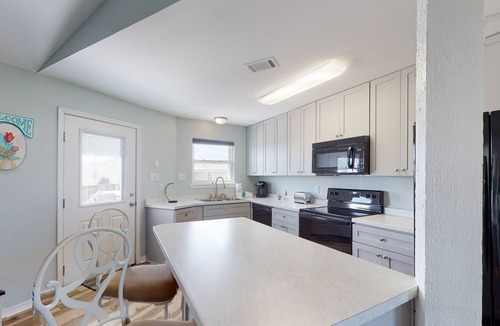 Royal Lagoons House | Spacious bay front getaway with dock, canal access, gas grill, & furnished deck