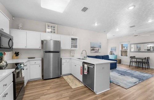 Bel Air House | Spacious Beachside Townhouse with Lagoon access, 2 car garage, and a pool!l