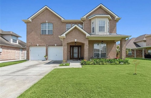 Timberlane House | Spacious comfortable King room. Work-friendly. High-speed internet w/50" TVs