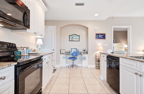 Upper Grand Lagoon Condo | Spacious family condo with large balcony & shared pool and hot tub