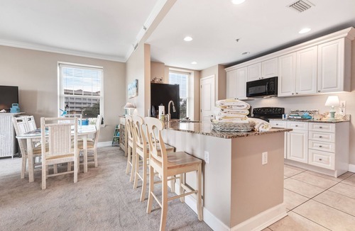Upper Grand Lagoon Condo | Spacious family condo with large balcony & shared pool and hot tub