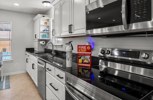 Ono Island House | Spacious Family Fun House: Large Private Screened in Pool, Game & Bunk Room