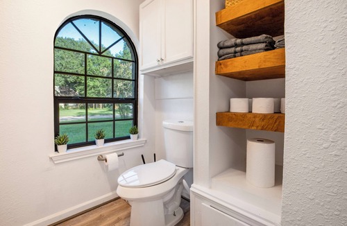 Friendswood House | Stay at St. Cloud, a comfortable house near Kemah Boardwalk that sleeps 7. Highlights include a king bed, fully fenced yard, 2-car garage, spacious kitchen, 4K TVs, foosball, and cozy fireplaces—ideal for families and small groups.