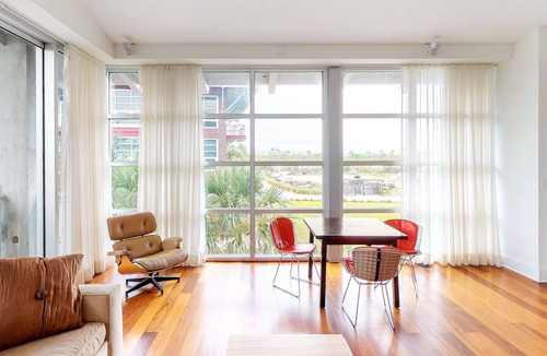 Port St. Joe Condo | Stylish coastal condo w/ shared pool, floor-to-ceiling windows & free WiFi