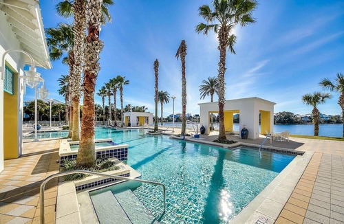 Sunnyside Apartment | Stylish condo with lake views, bike rentals, & pools - walk to the beach