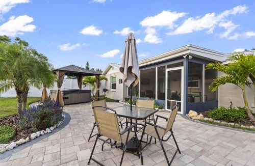 Crystal Lake House | Tropical Fenced Paradise, Hot Tub, & Home Theater