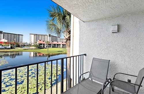 Panama City Beach Condo | Two-level waterfront condo near beach with balcony, patio, pool & hot tub