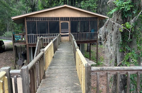 Karnack House | Two Story House with deck over the river