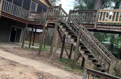 Karnack House | Two Story House with deck over the river