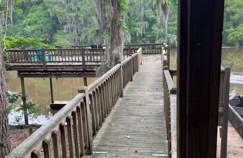 Karnack House | Two Story House with deck over the river