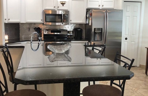 Tropical Cove Condo | Updated 3 bdrm 2 bath condo in a beautiful gated secure Golf/Tennis Community.