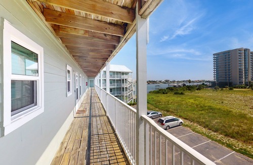 Orange Beach East Condo | Updated condo with Gulf & river views & pool - across from beach & near dining