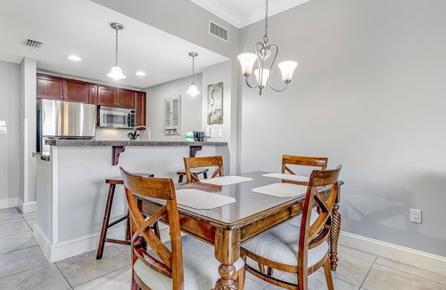 Baytowne Wharf Condo | Vibrant seventh-floor condo with pool, hot tub, sauna, private W/D & fast WiFi
