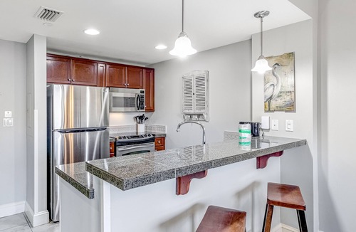 Baytowne Wharf Condo | Vibrant seventh-floor condo with pool, hot tub, sauna, private W/D & fast WiFi