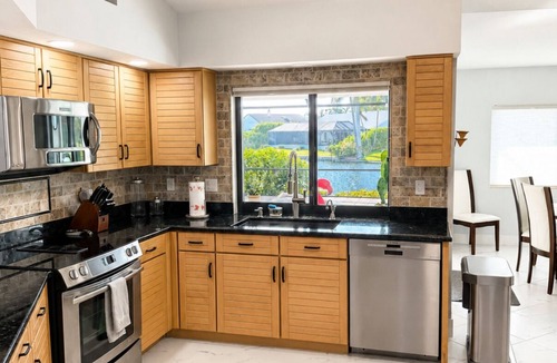 Town and River House | Villa Mermaid Oasis,Lakefront Paradise with 4BR/3BA, Spacious Layout Heated Pool