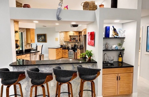 Town and River House | Villa Mermaid Oasis,Lakefront Paradise with 4BR/3BA, Spacious Layout Heated Pool