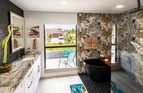Town and River House | Villa Mermaid Oasis,Lakefront Paradise with 4BR/3BA, Spacious Layout Heated Pool